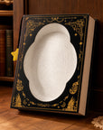 Book-shaped scratcher upright in room