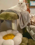 white longhaired cat lying on top platform of Four Leaf Clover Cat Tree