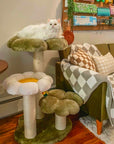 white longhaired cat lying on top platform of Four Leaf Clover Cat Tree next to sofa