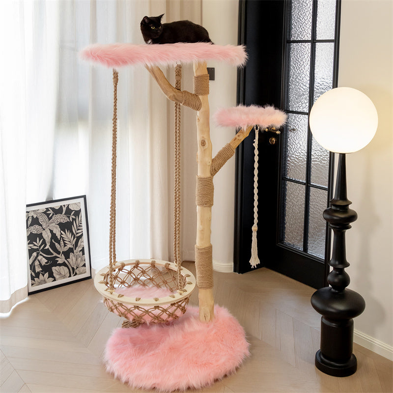 Close-up detail of a black cat climbing on the platform of the Cloud Swing Cat Tree