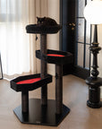 A cat on the soft cushioned top platform of the Gothic Style Cat Tree