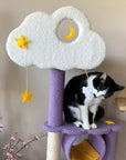 A cat playing with the hanging toy on the Moonlight Cat Tree