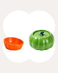 Green Pumpkin Patch fountain with an orange ceramic cat bowl.