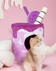 A cat playing in front of the Taro Milk Tea Cat Tree