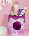 A cat sitting on the Taro Milk Tea Cat Tree