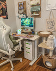 A white cat sitting on the platform of the Brown Rattan Cat Tree, matching the room's style.