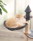 Cat lounging in the Wooden House Cat Tree hammock – soft and cozy resting area.