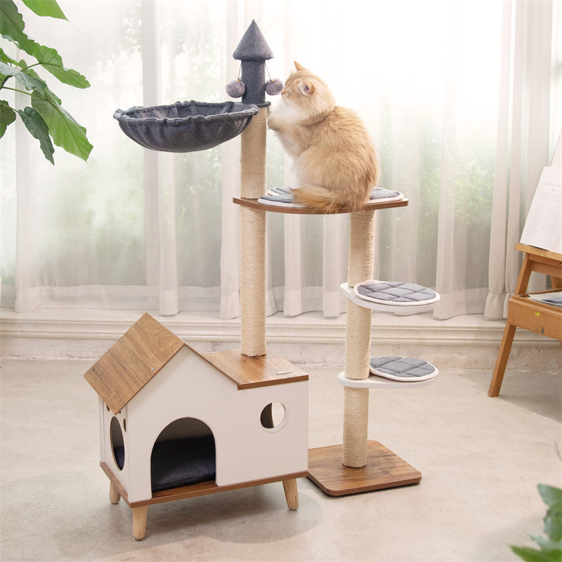 Cat scratching the Wooden House Cat Tree sisal post – durable scratching post for active cats.