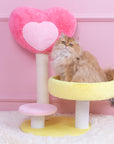 Cat sitting on the Hit Your Heart Cat Tree Yellow Platform.