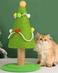 Cat sitting next to Christmas Tree Cat Scratcher, highlighting the festive design.