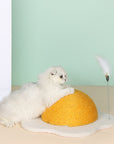 A kitten scratching the Egg Series Cat Sisal Scratcher Toy, side view showing its size and durability.